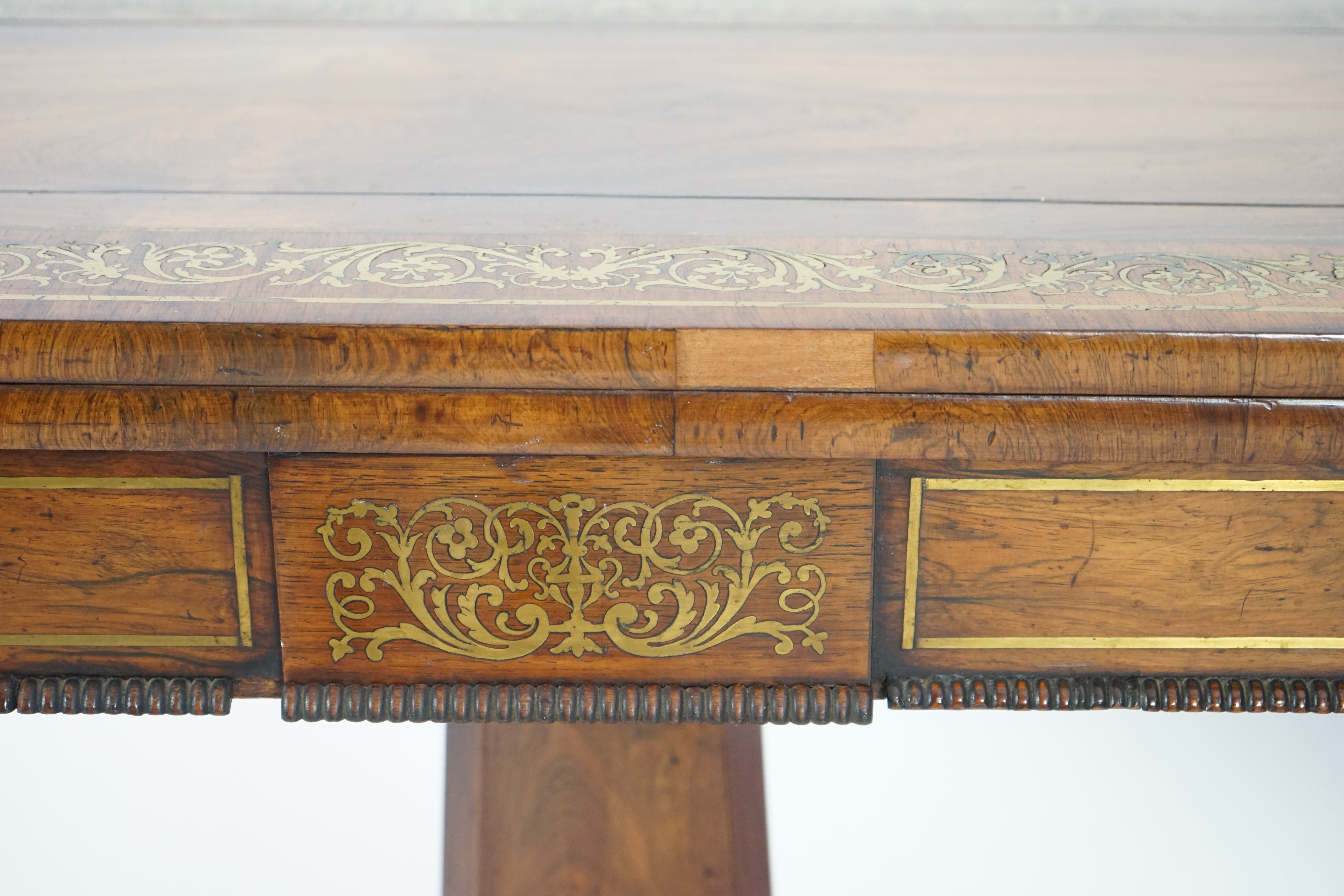 A pair of Regency brass inset rosewood card tables